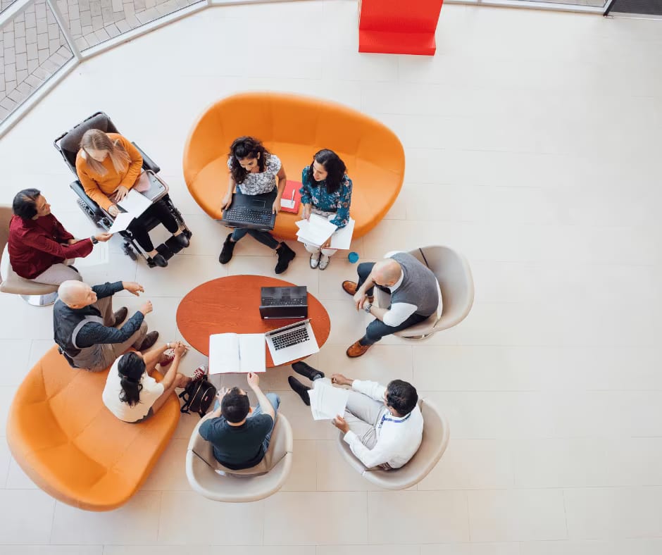 A group of people in a support group discussing recovery from for alcohol and depression