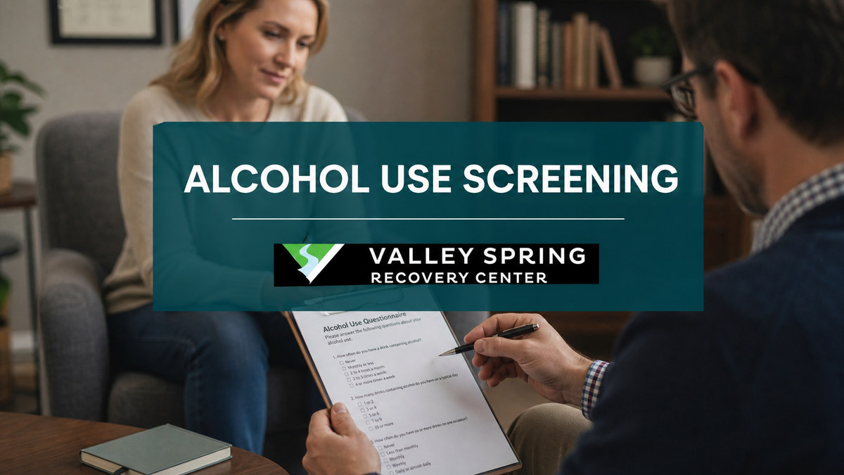 Clinician reviewing an alcohol-use screening questionnaire with an adult patient