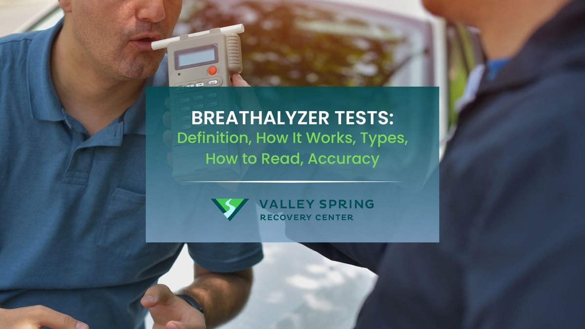 Breath alcohol test being administered beside the Valley Spring Recovery Center logo