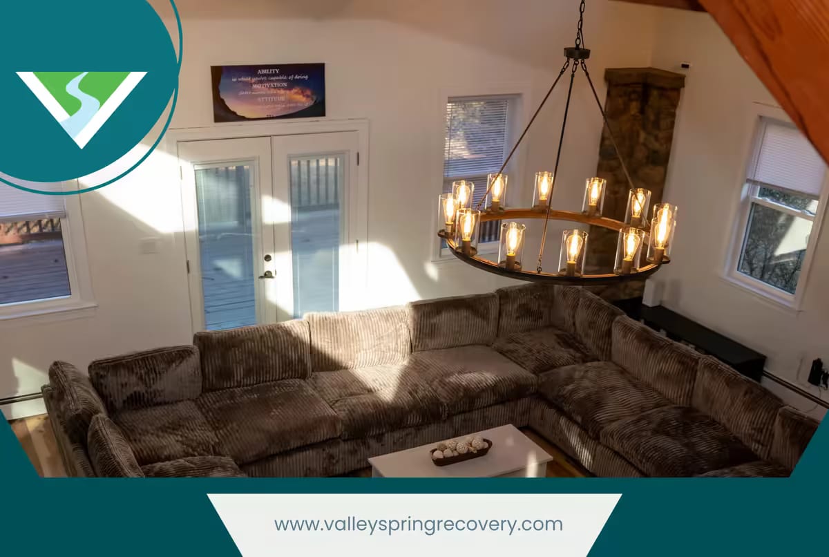 Sectional seating under a wrought-iron chandelier in a Valley Spring Recovery Center group room Sectional seating under a wrought-iron chandelier in a Valley Spring Recovery Center group room