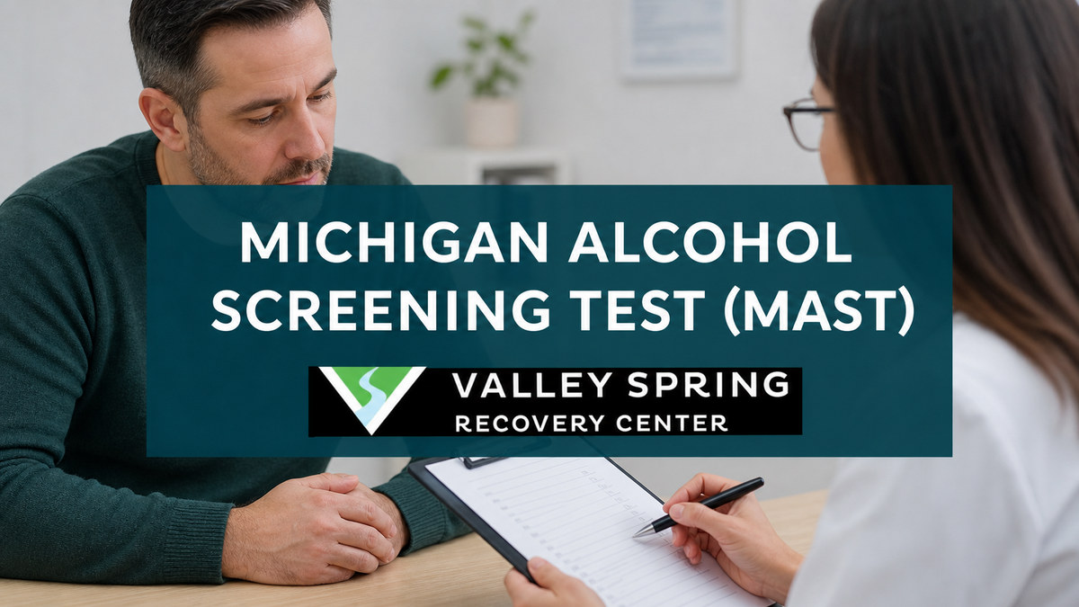 Adult patient reviewing the Michigan Alcohol Screening Test with a clinician and Valley Spring Recovery Center branding