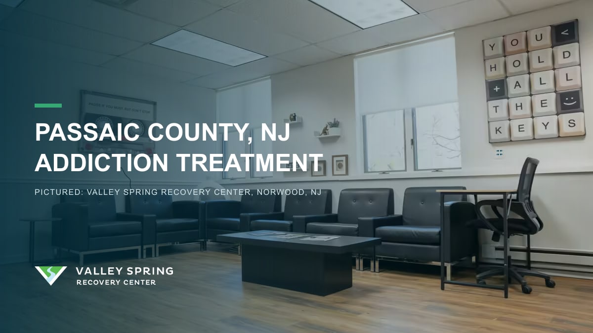 Waiting area with black leather chairs and a You Hold the Keys sign at Valley Spring Recovery Center in Norwood, New Jersey, branded for Passaic County addiction treatment