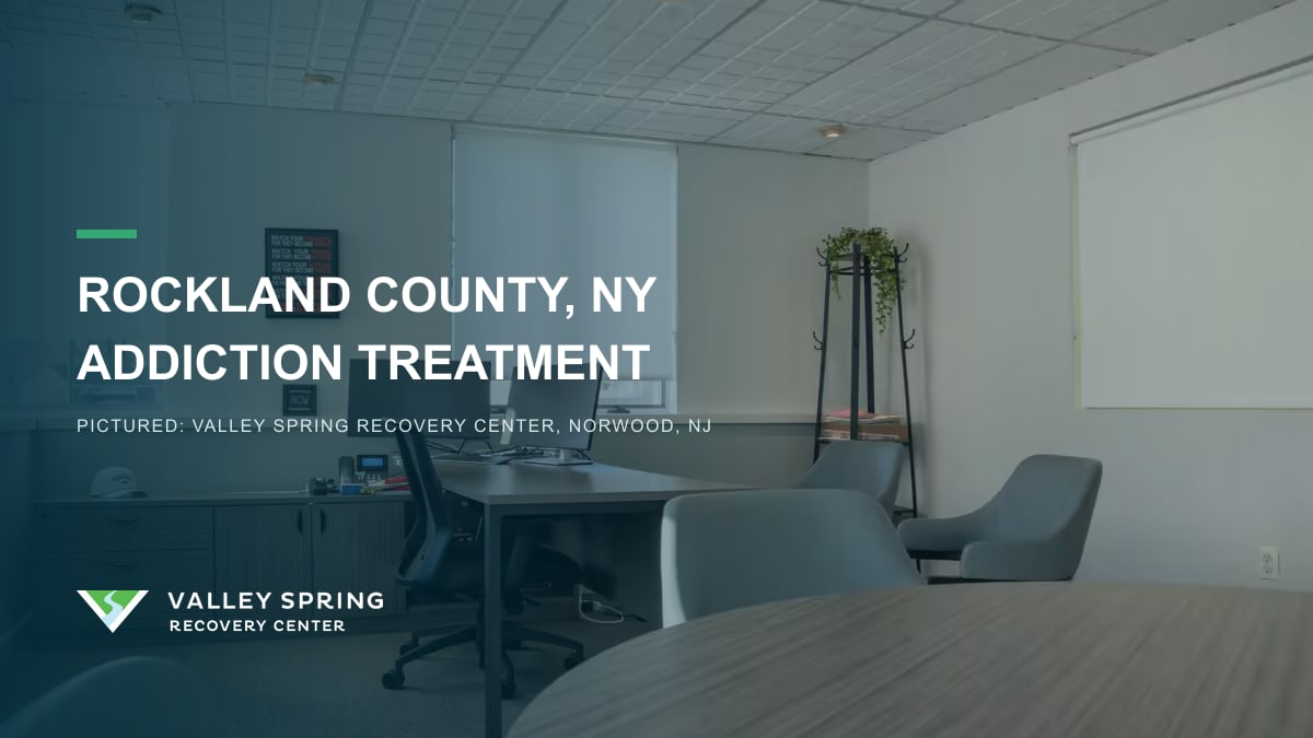 Staff workspace with desks and a round table inside Valley Spring Recovery Center in Norwood, New Jersey, branded for Rockland County, New York addiction treatment
