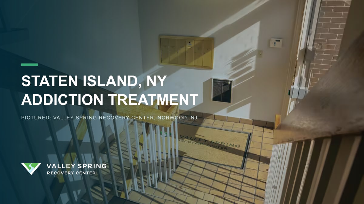 Sunlit stairwell inside Valley Spring Recovery Center in Norwood, New Jersey, branded for Staten Island, New York addiction treatment access