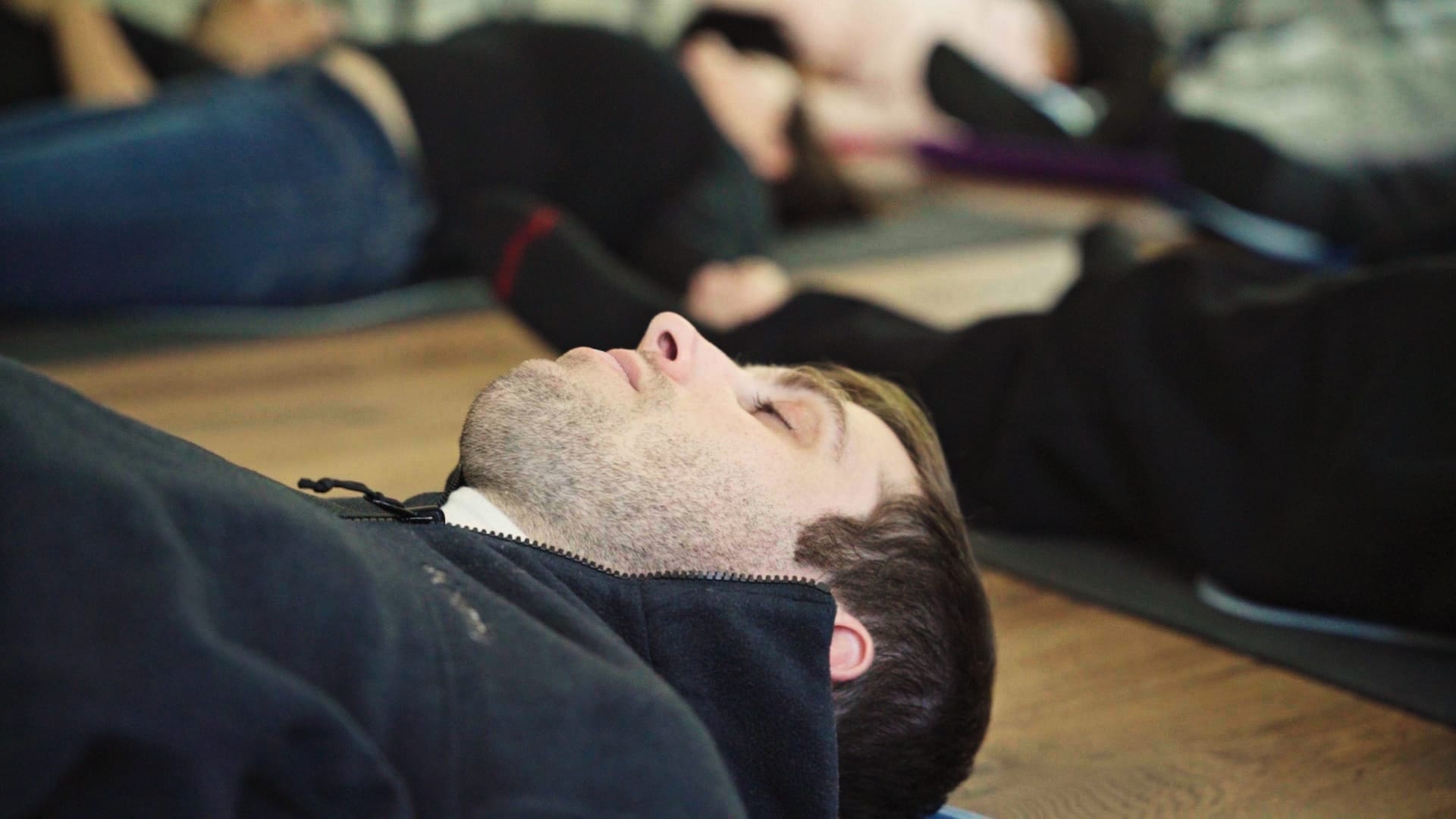 A client rests during a guided meditation group at Valley Spring Recovery Center in Norwood, New Jersey