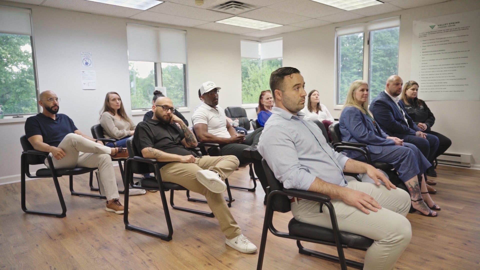 Guests and clinicians seated in the main group room at Valley Spring Recovery Center in Norwood, NJ
