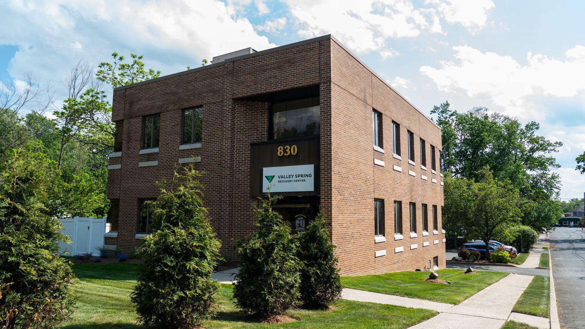 Brick exterior of Valley Spring Recovery Center at 830 Broadway in Norwood, New Jersey, with the Valley Spring sign over the entrance