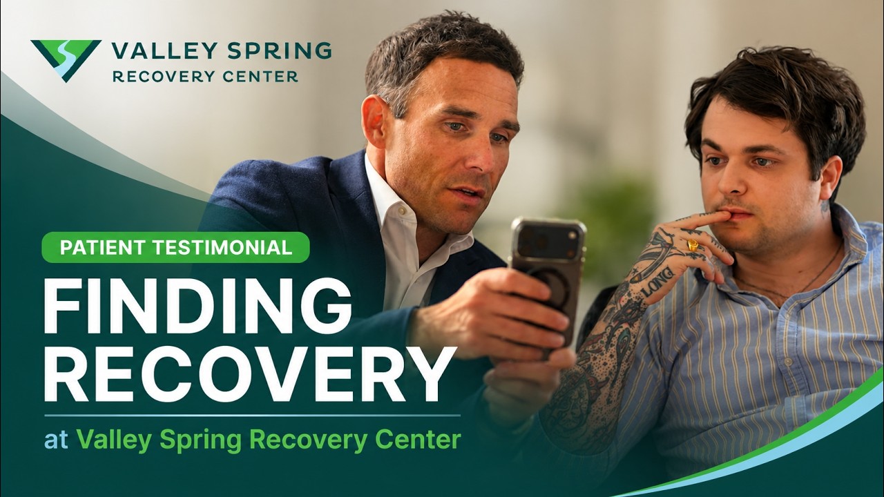 Title card for a Valley Spring Recovery Center patient testimonial, showing two men talking over a phone beside the words Finding Recovery