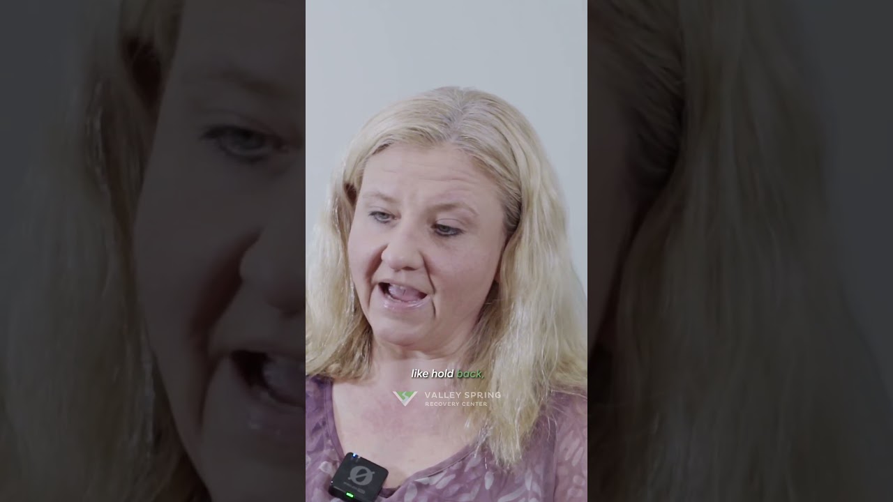 Still from a Valley Spring Recovery Center alumni testimonial, showing Regina speaking mid-interview above the Valley Spring wordmark