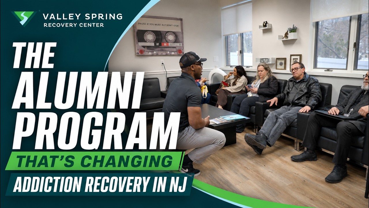 Title card for the Valley Spring Recovery Center THRIVE alumni program film, showing an alumni group meeting in the Norwood lounge beside the words The Alumni Program That's Changing Addiction Recovery in NJ