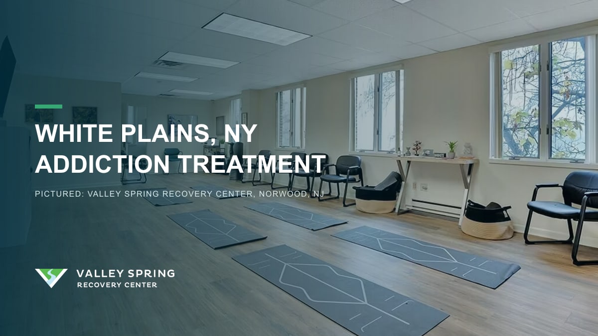 Group room with yoga mats and chairs inside Valley Spring Recovery Center in Norwood, New Jersey, branded for White Plains, New York addiction treatment access