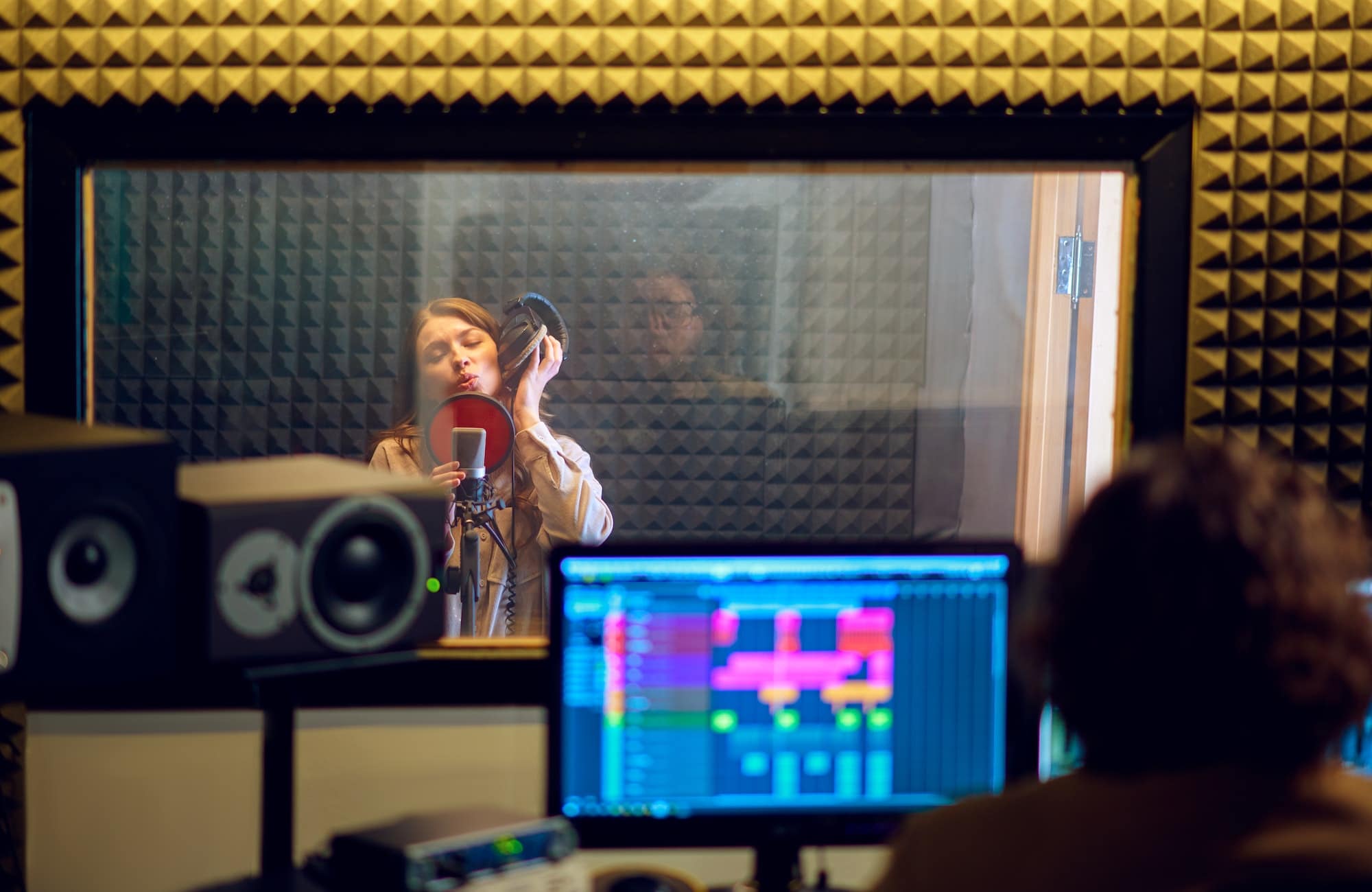 Male musician and female singer, recording studio