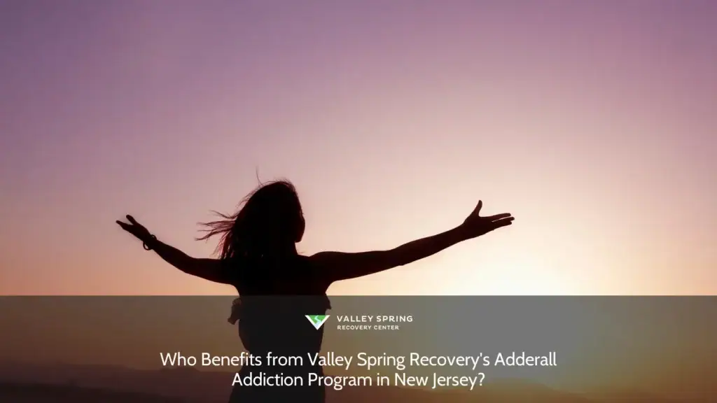 Silhouette of a woman with outstretched arms against a vibrant sunset sky, symbolizing freedom and hope, relevant to Valley Spring Recovery's Adderall program.