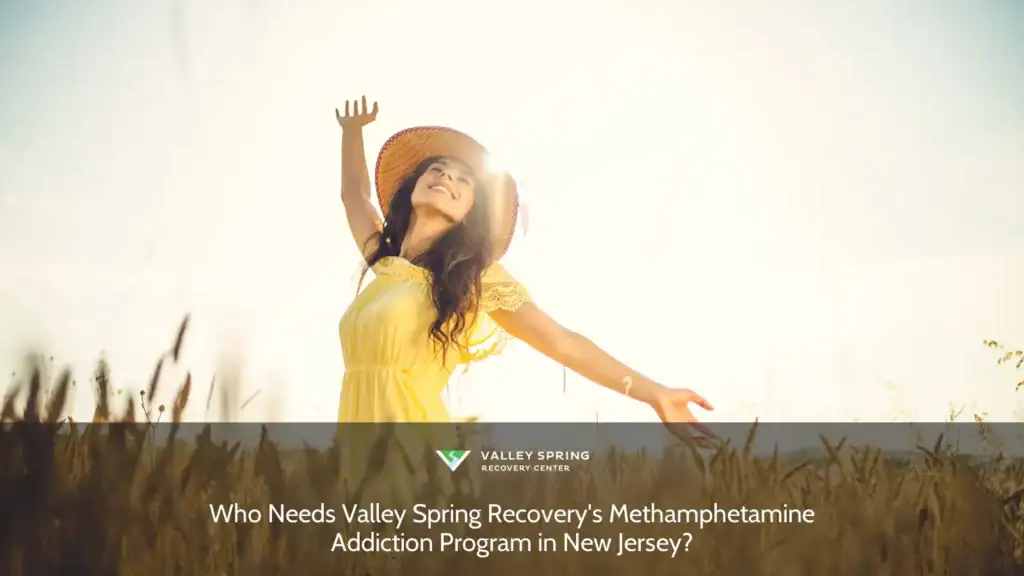 Joyful woman in a yellow dress and sun hat, stretching her arms in a golden wheat field, basking in sunlight and freedom. Perfect for summer wellness themes.