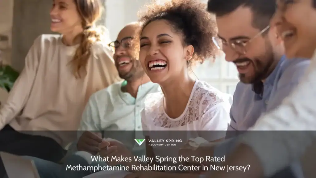 Group of five diverse individuals enjoying a lively moment together, emphasizing connection and joy in a bright, inviting space.