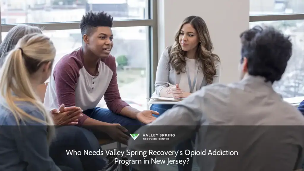 A diverse group engages in a discussion during a therapy session, emphasizing the importance of support for those in need of opioid addiction recovery in New Jersey.