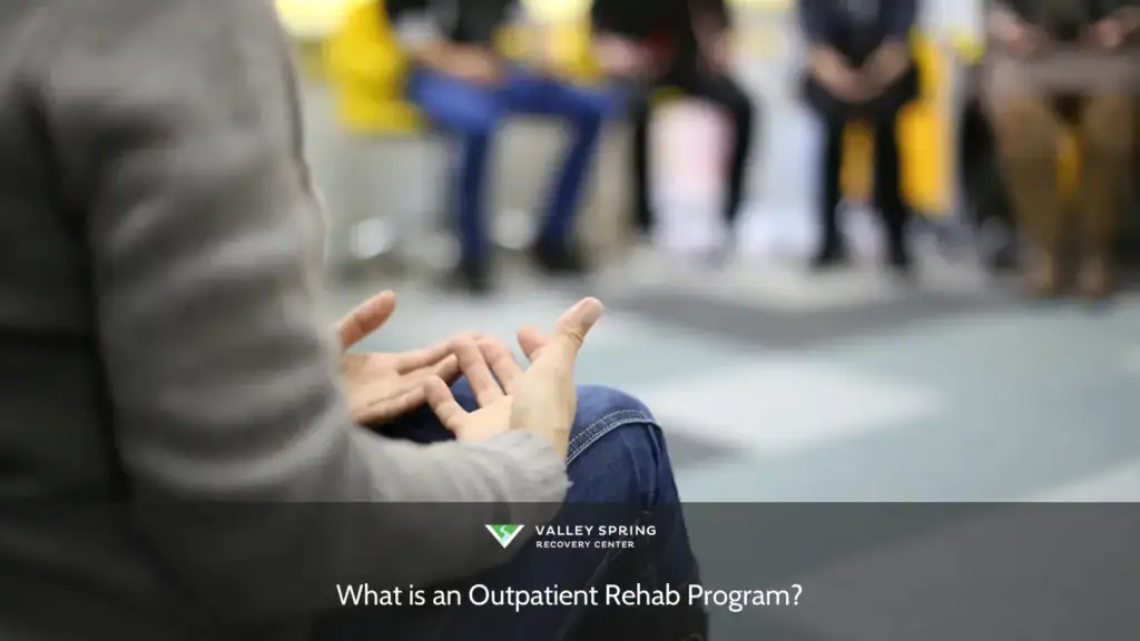 Hands gesturing during a discussion in an outpatient rehab program, focusing on group interaction and the sharing of experiences.