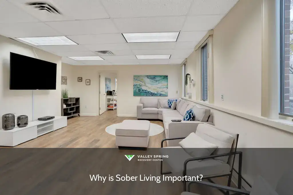 Brightly lit lounge area featuring a sectional sofa and armchairs, promoting discussions on "Why is Sober Living Important?" in a welcoming environment.